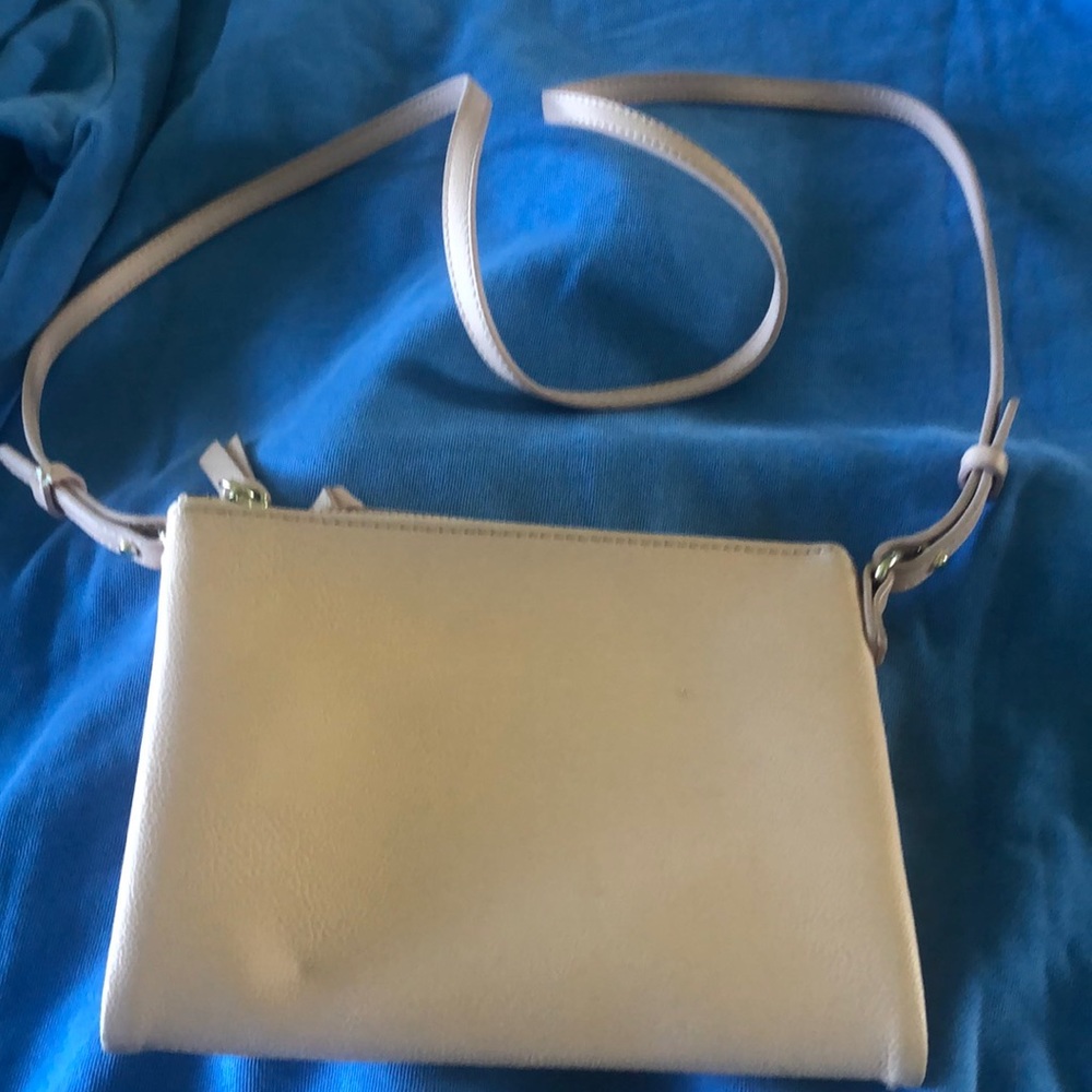 Crossbody pale pink 2 zippers snap center section NWOT never used